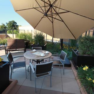 A cozy outdoor seating area perfect for enjoying the sunshine.