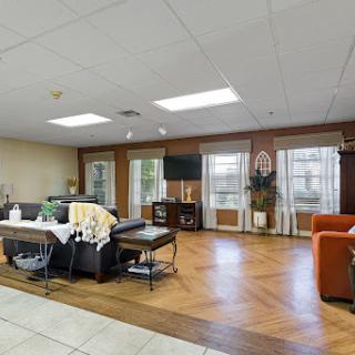 A spacious and inviting living room featuring modern furniture and ample natural light.