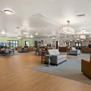 A spacious and modern lobby with comfortable seating and bright lighting.