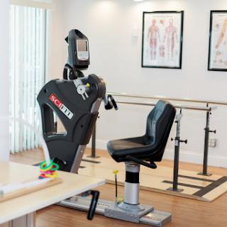 A modern rehabilitation room featuring exercise equipment designed for physical therapy, highlighting a focus on fitness and recovery.