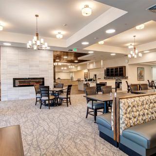 A modern dining area with stylish lighting and furniture.