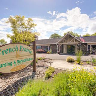 Entrance to French Prairie Nursing & Rehabilitation Center, showcasing a welcoming environment.