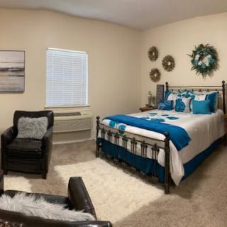 A cozy and modern bedroom with stylish decorations and comfy furniture.