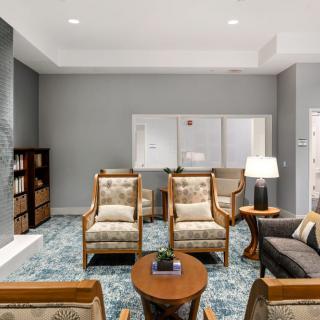 A modern living room with comfortable seating and elegant decor.
