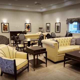 A cozy living room with elegant furniture and decor.