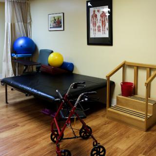 A therapy room equipped with exercise tools and rehabilitation aids for patient recovery.