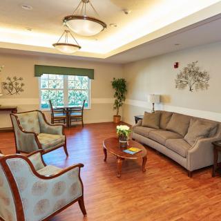 A cozy living room with comfortable seating and elegant decor.