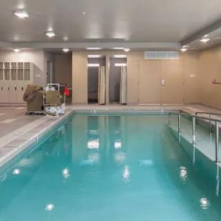 An indoor swimming pool in a recreation or gym facility.