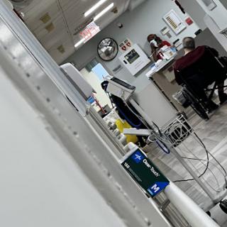 A glimpse into a busy hospital waiting area with patients and medical staff.