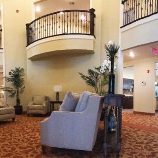 A spacious lobby with comfortable seating and elegant decor.
