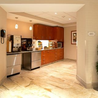 A modern kitchen interior with sleek cabinets and appliances.