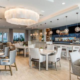 A modern restaurant interior with elegant decor and a well-lit dining area.