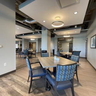 A modern dining area with stylish furniture and contemporary lighting.