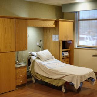 A well-equipped patient room in a modern hospital.