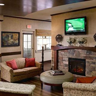 Cozy living room with a fireplace and television.
