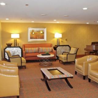 A stylish hotel lobby with comfortable seating and warm lighting.