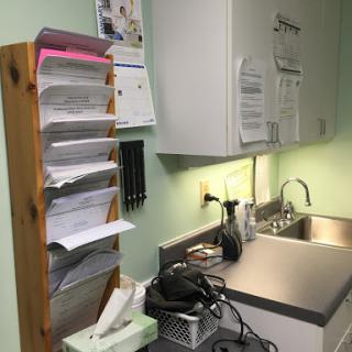 A well-organized medical office with documents neatly arranged and a clean workspace.