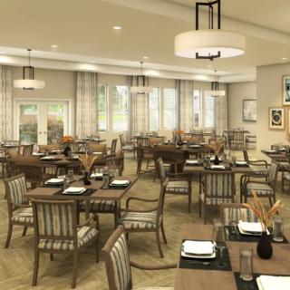 A spacious and elegantly decorated restaurant interior featuring neatly arranged tables and chairs.