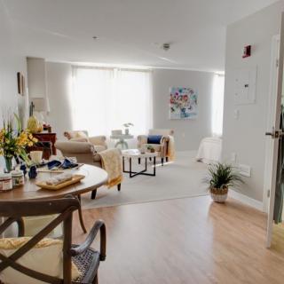 A cozy living and dining area with natural light and stylish decor.