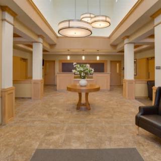 A spacious and elegantly designed lobby with contemporary lighting and decor.
