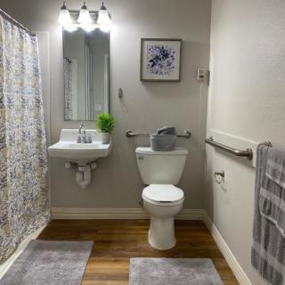 A well-organized bathroom with modern fixtures and simple decor.
