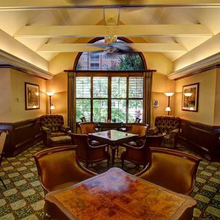 A cozy and luxurious lounge with elegant furniture and warm lighting.