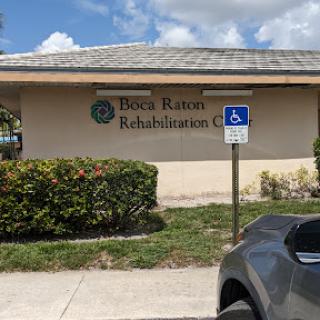 A view of the Boca Raton Rehabilitation Center featuring accessible parking.