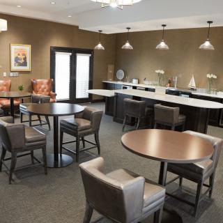A modern lounge area with comfortable seating and ambient lighting.