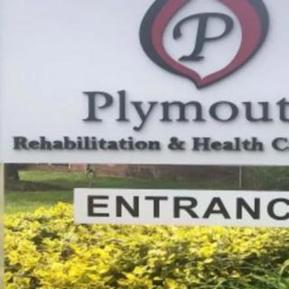 A sign for Plymouth Rehabilitation & Health Care, indicating the entrance.
