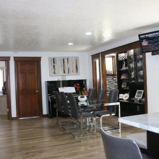 A modern dining room with sleek furniture and stylish decor.