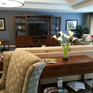 A cozy and elegantly arranged living room featuring comfortable seating and a stylish coffee table.
