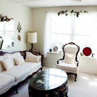 A bright living room with vintage-style furniture and decor.