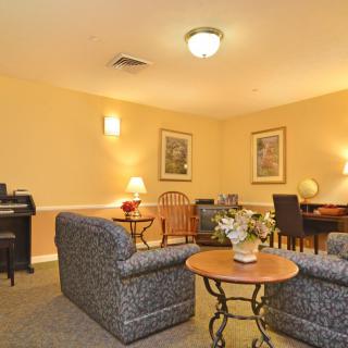 A cozy living room with comfortable seating and warm lighting.