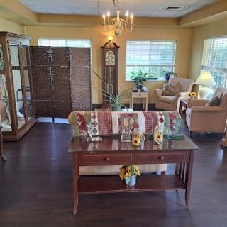 A cozy and well-decorated living room featuring warm colors and elegant furnishings.