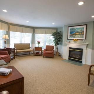 A cozy living room with comfortable seating and a fireplace.