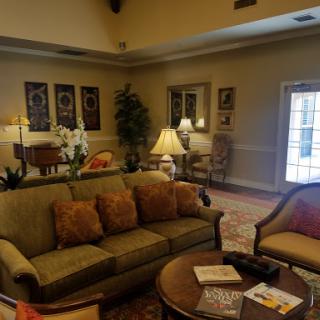 A cozy living room setup with comfortable seating and warm decor.