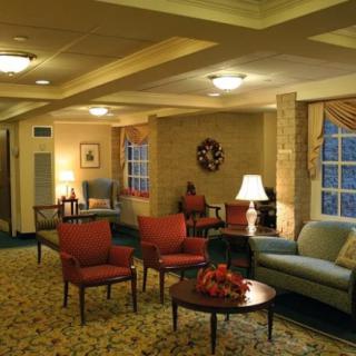 A cozy lobby with comfortable seating and warm lighting.