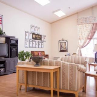 A cozy living room with comfortable furniture and a television setup.