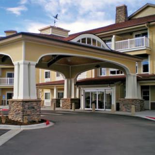 An inviting entrance to a large building, possibly a hotel or residence.