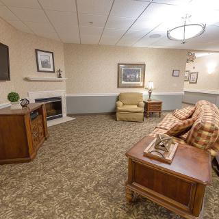 A cozy and well-decorated living room with comfortable furniture and warm lighting.