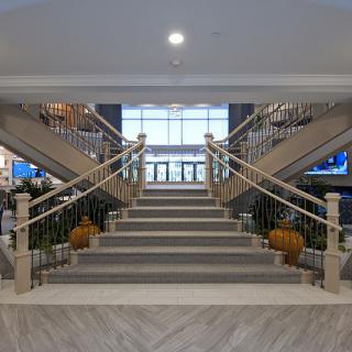 A luxurious lobby featuring a grand symmetrical staircase.