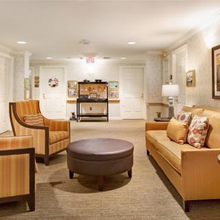 A cozy living room with comfortable seating and elegant decor.