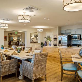 A modern, cozy dining area with stylish furniture and warm lighting.