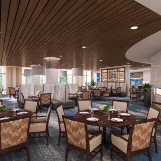 A modern restaurant interior featuring elegantly arranged tables and chairs with stylish lighting.