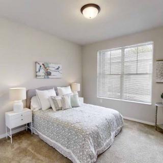 A cozy bedroom with soft lighting and elegant decor.