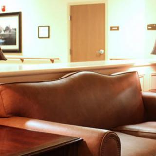 A hospital waiting room with comfortable seating and a calm atmosphere.