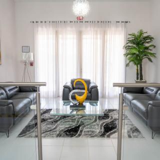 A modern living room with sleek furniture and contemporary decor.