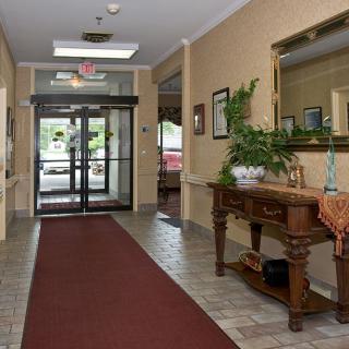 A cozy lobby area with classic decor and a welcoming entrance.