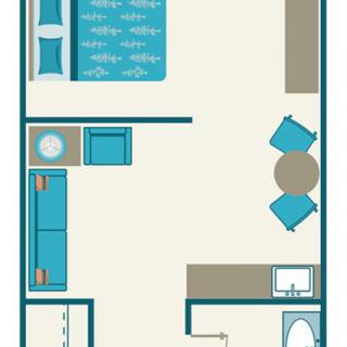A simple studio apartment layout with designated areas for sleeping, dining, and a kitchenette.
