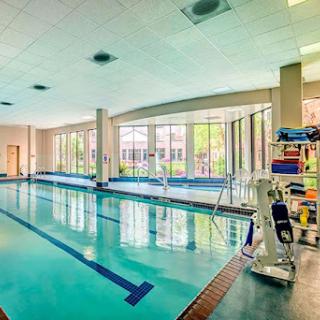 A bright and inviting indoor swimming pool, perfect for relaxation and exercise.